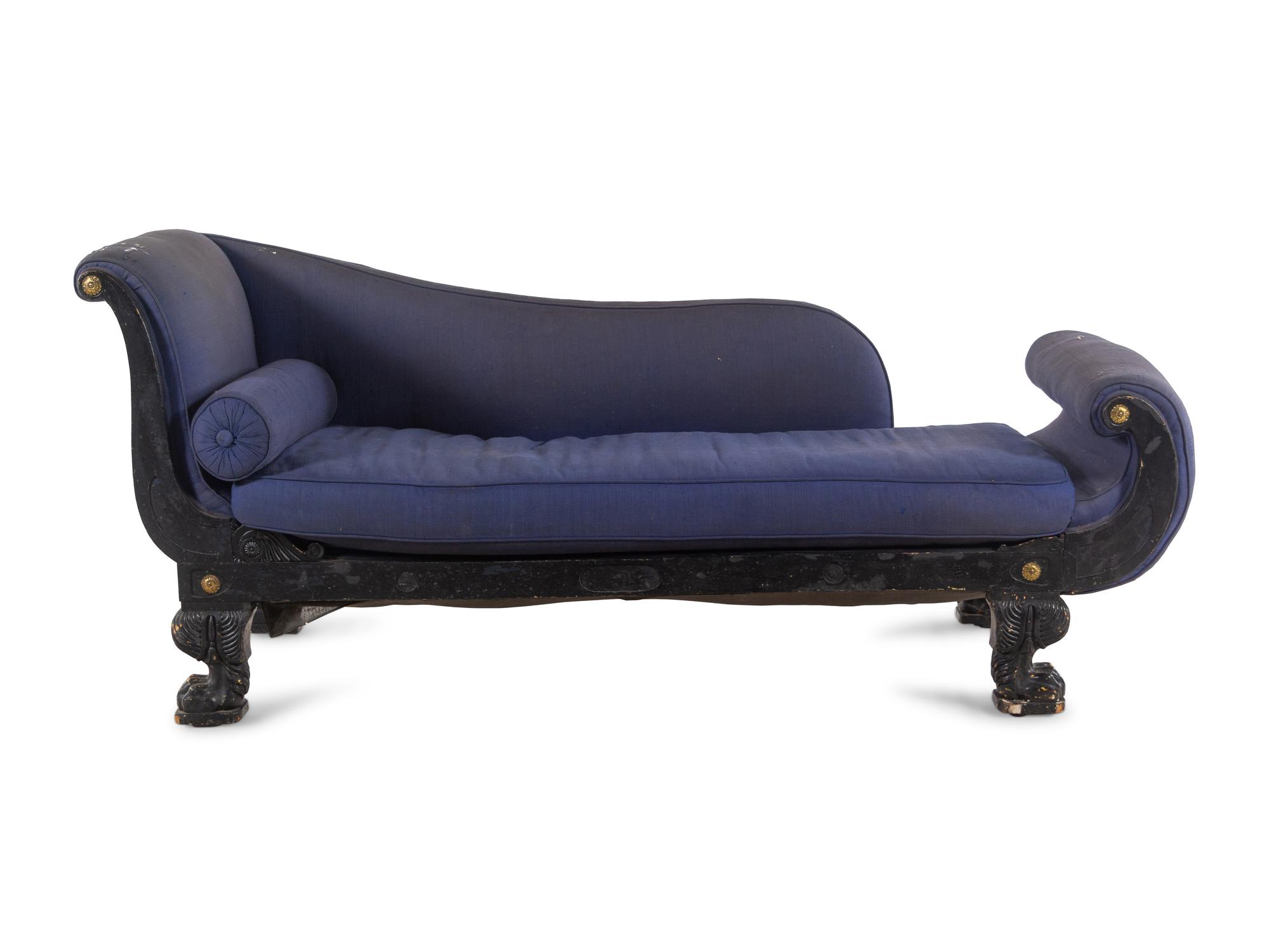 An Empire Style Gilt Metal Mounted Ebonized Chaise Longue