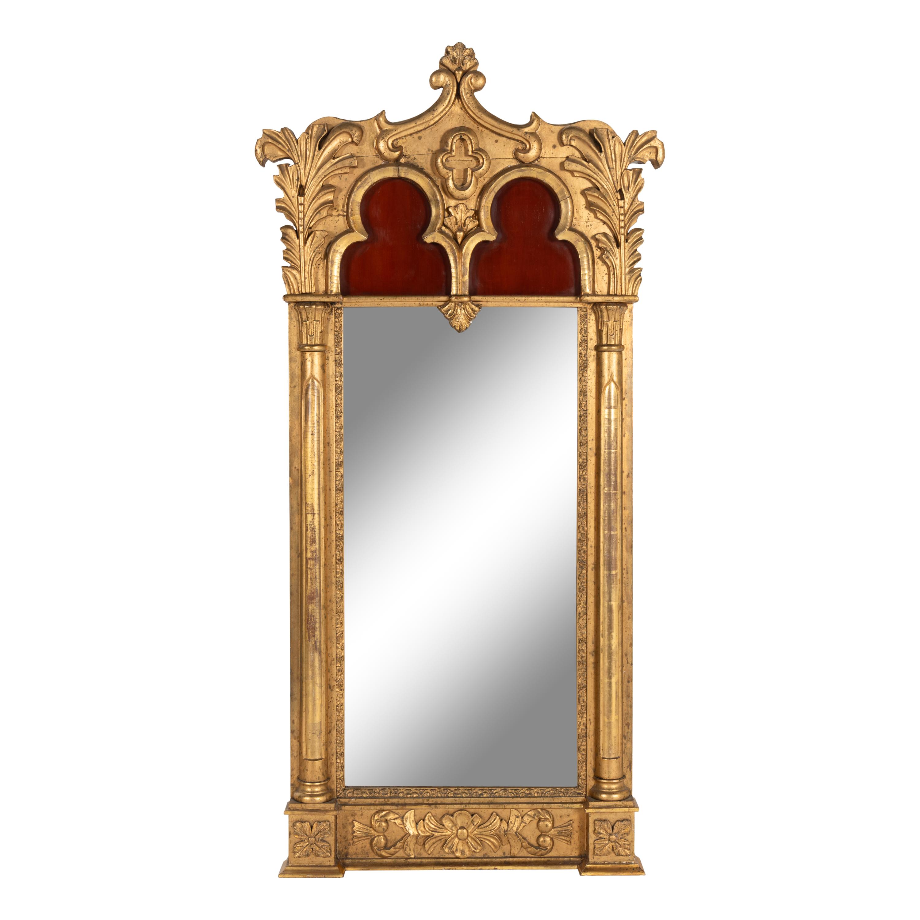 A Gothic Revival Giltwood and Gesso Pier Glass.