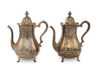 A Pair of Cartier Silver-Gilt Teapots