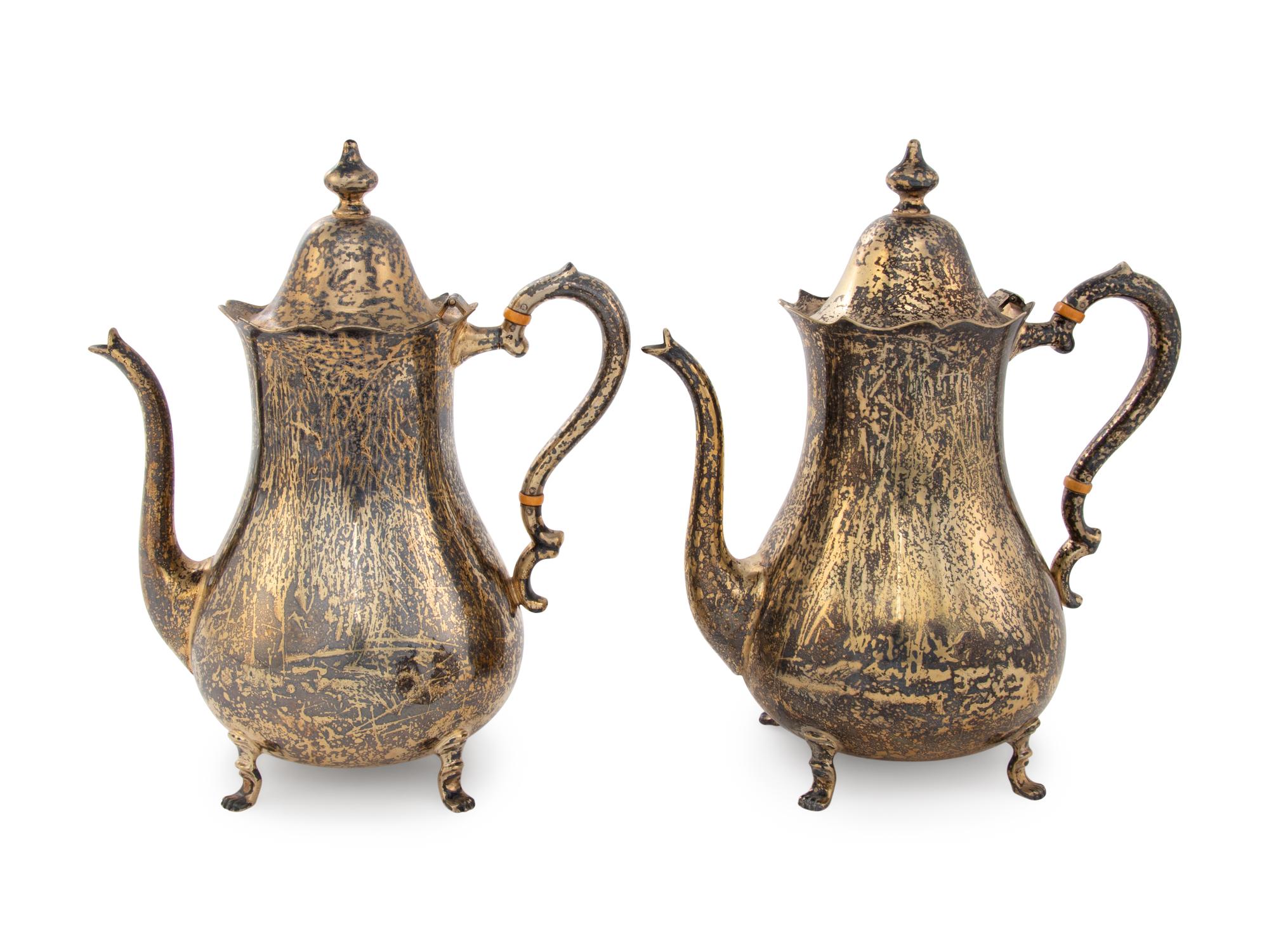 A Pair of Cartier Silver-Gilt Teapots