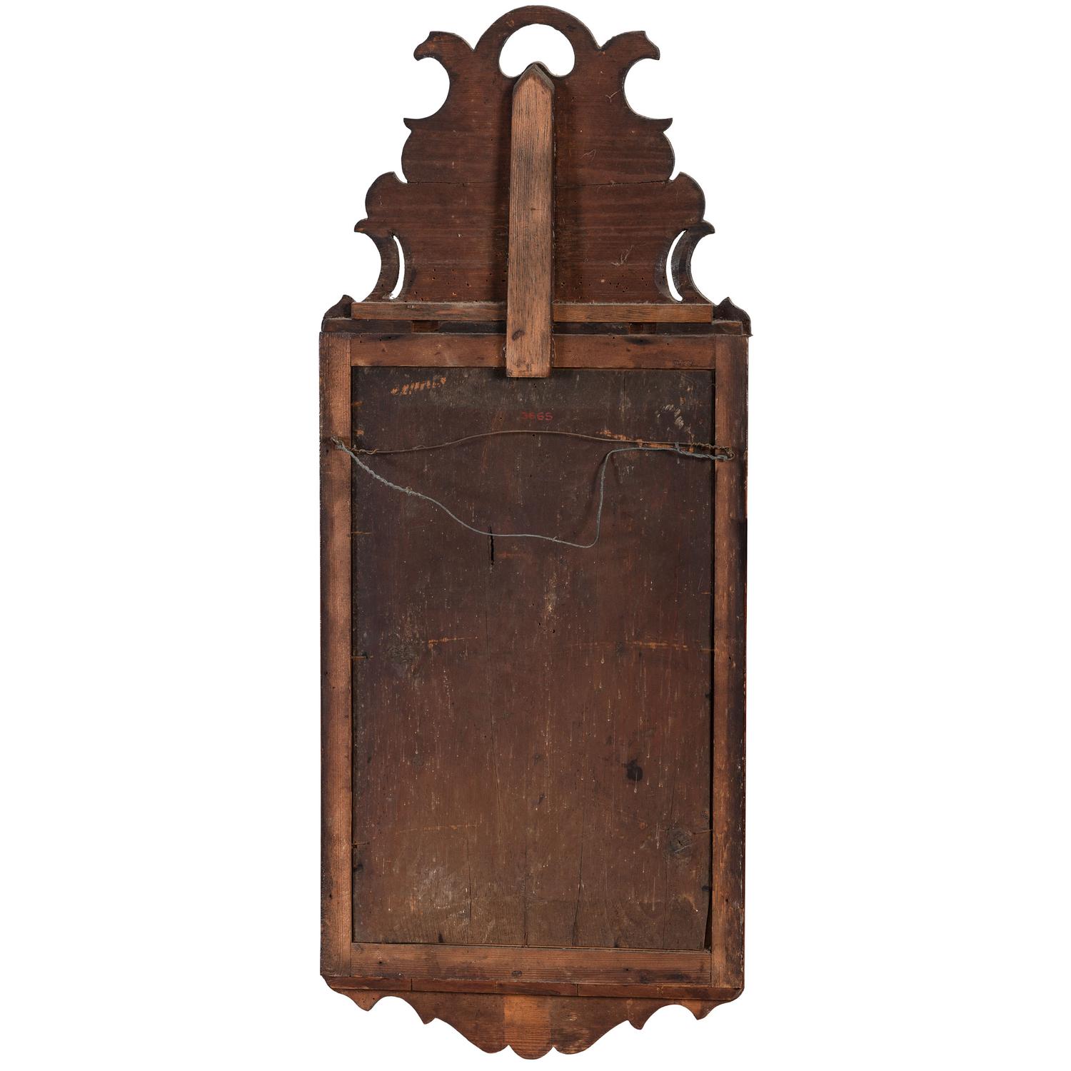 A Queen Anne Parcel Gilt and Carved Walnut Looking Glass