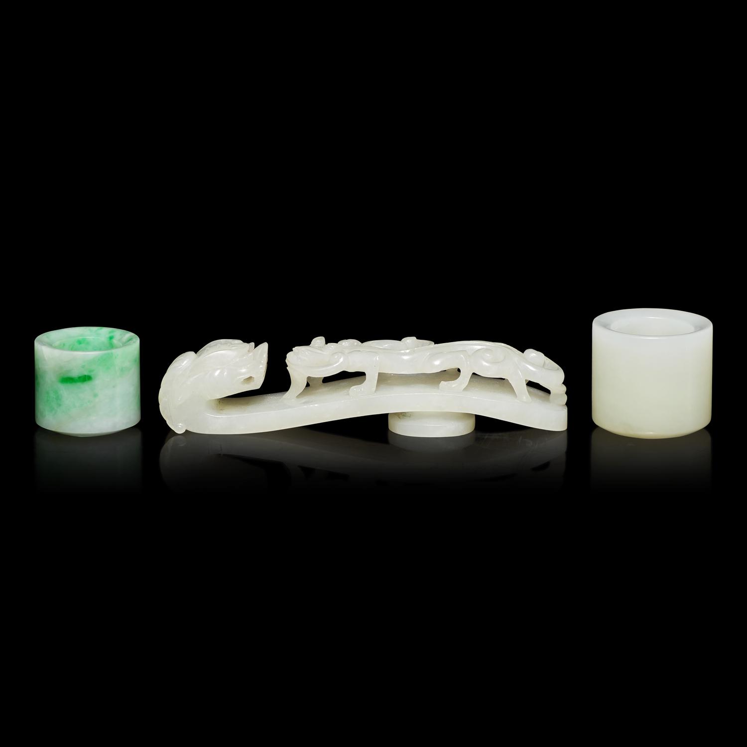 Two Chinese Jade and Jadeite Archer's Rings and a Jade 'Dragon' Belt Hook, Qing Dynasty 清 白玉、翡翠扳指及龍鈎一組三件