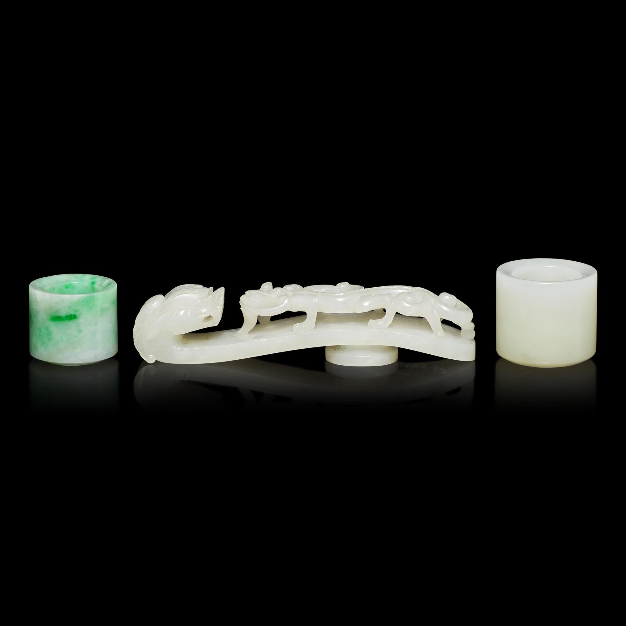 Two Chinese Jade and Jadeite Archer's Rings and a Jade 'Dragon' Belt Hook, Qing Dynasty 清 白玉、翡翠扳指及龍鈎一組三件