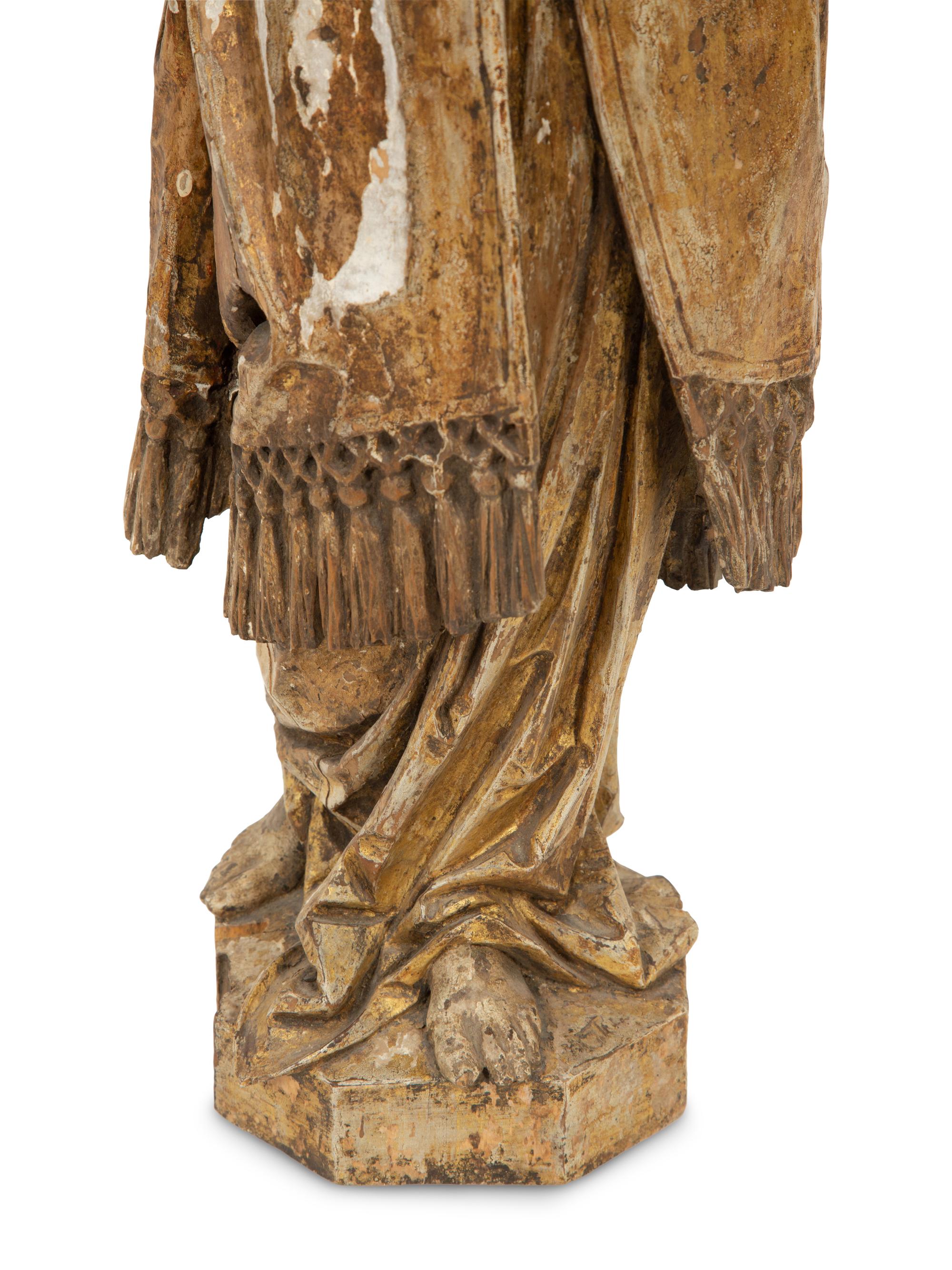 A Continental Carved Polychrome and Gilt Wood Figure