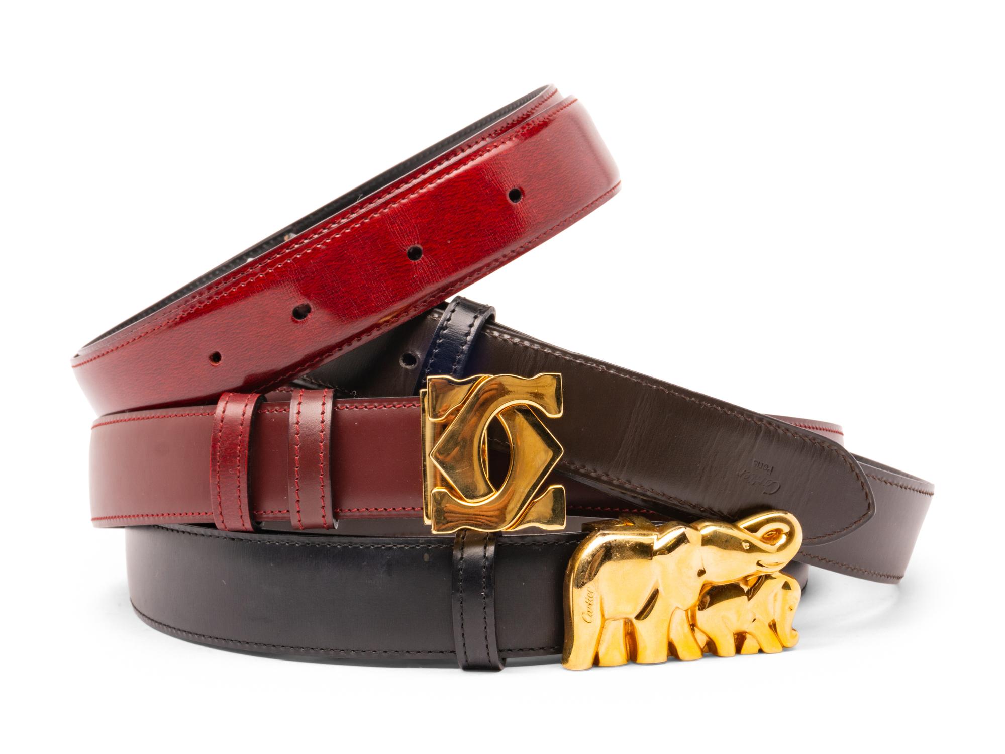 A Group of Two Cartier Belt Buckles and Four Straps