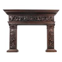 An Italian Carved Walnut Mantelpiece