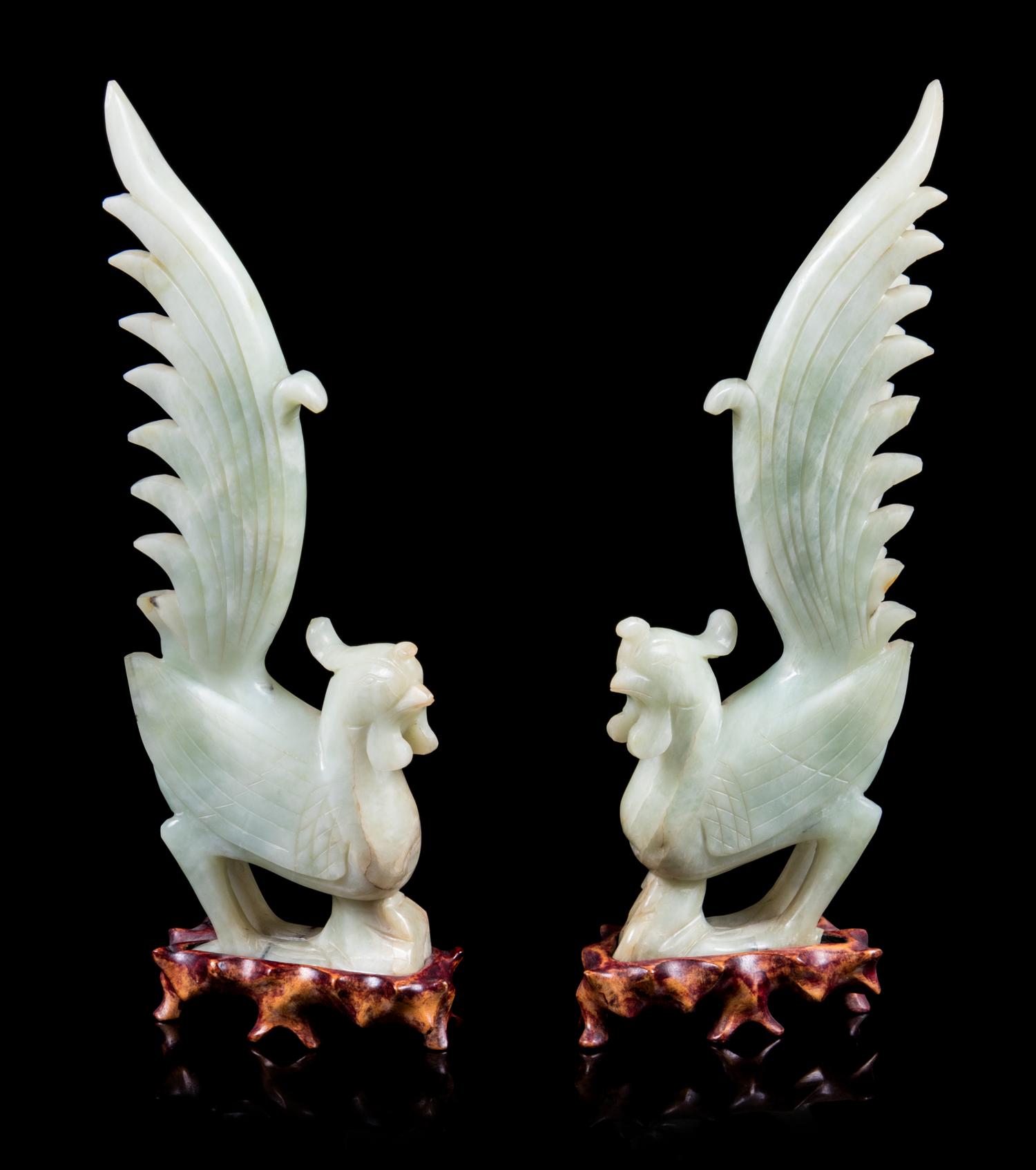 A Pair of Chinese Celadon Jade Figures of Phoenix Height of figure 12 inches. — 20TH CENTURY