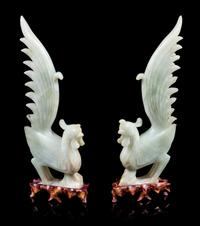 A Pair of Chinese Celadon Jade Figures of Phoenix Height of figure 12 inches. — 20TH CENTURY