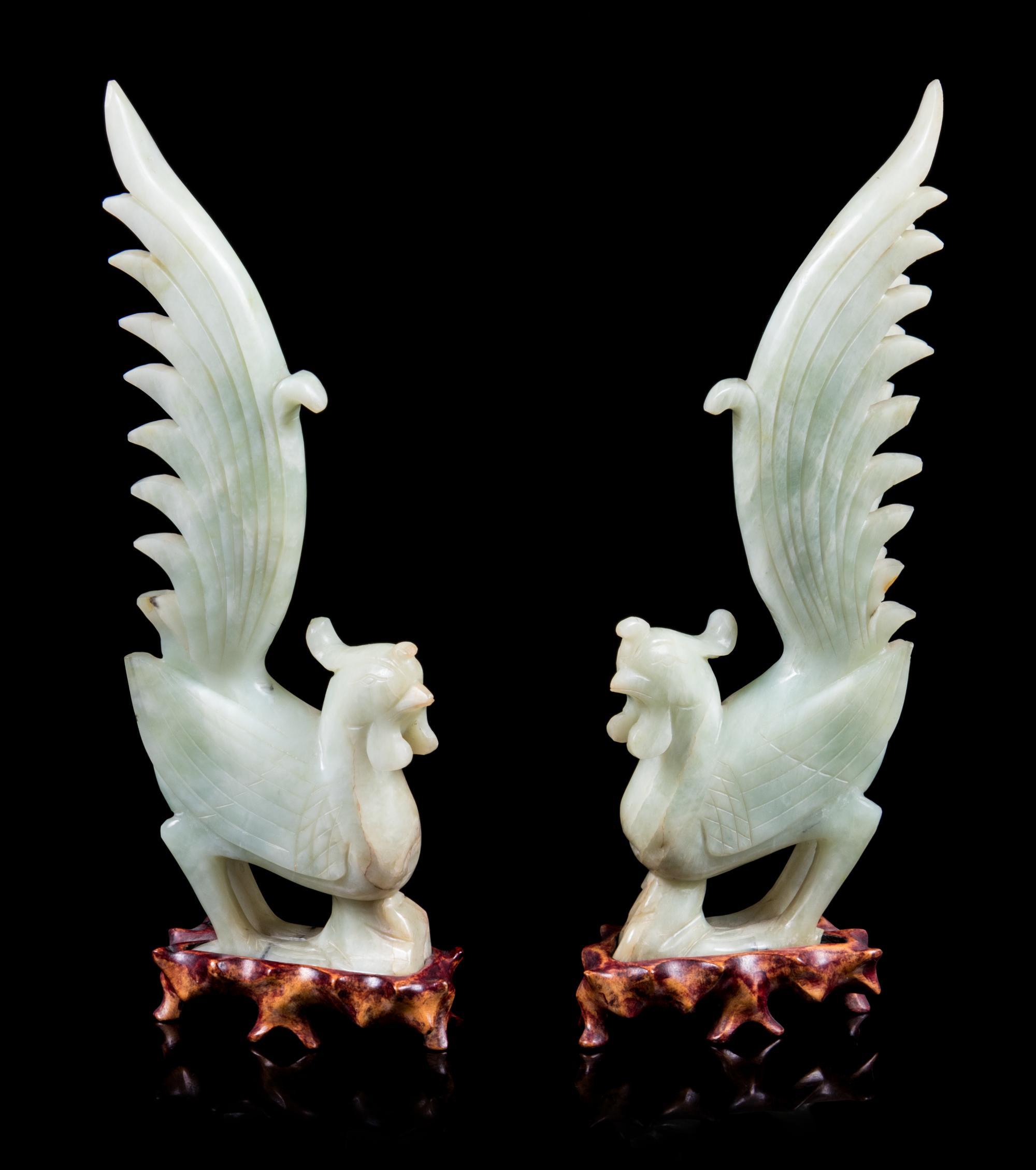 A Pair of Chinese Celadon Jade Figures of Phoenix Height of figure 12 inches. — 20TH CENTURY