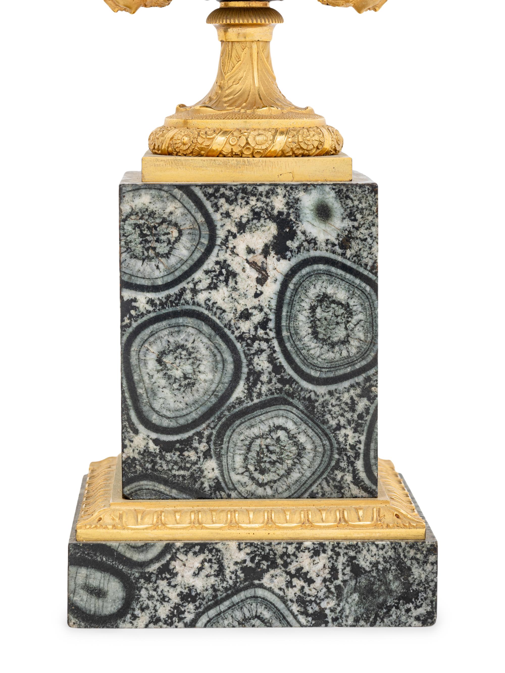 A Pair of Restauration Gilt and Patinated Bronze and Granite Urns