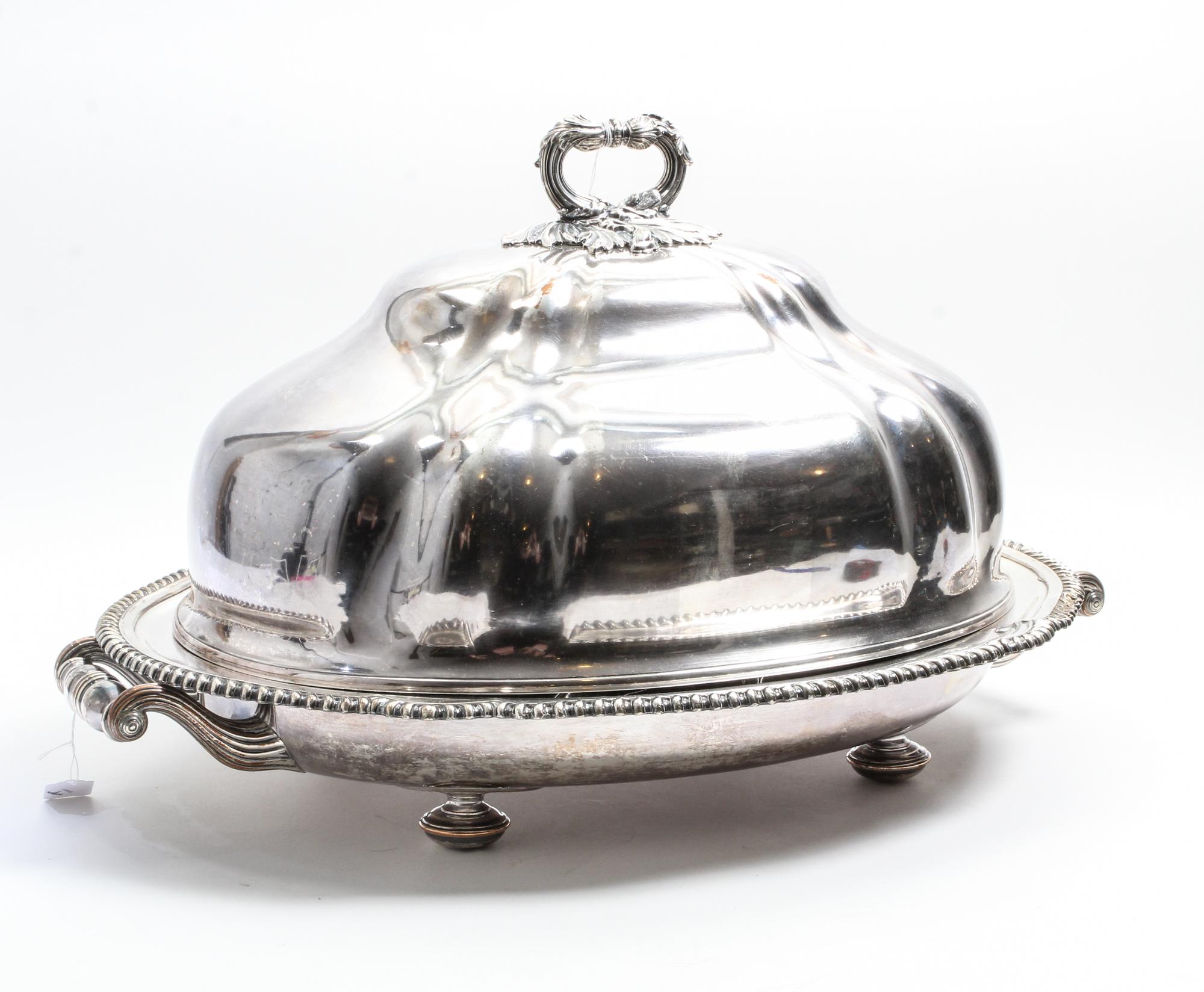 A Silver-Plate Cloche. Width over handles 26 1/2 inches.