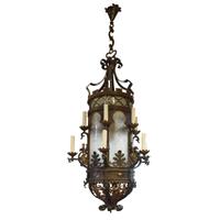 A Bronze and Iron Chandelier from a Chicago Theatre 28" W x 28" D x 75" H — United States, 20th Century