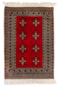 A Pakistani Wool Rug 4 feet 7 inches x 3 feet 2 inches. — 20TH CENTURY