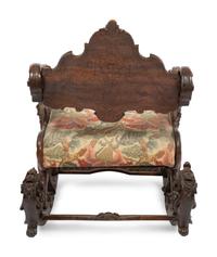 An Italian Carved Walnut Fantasy Rocking Chair