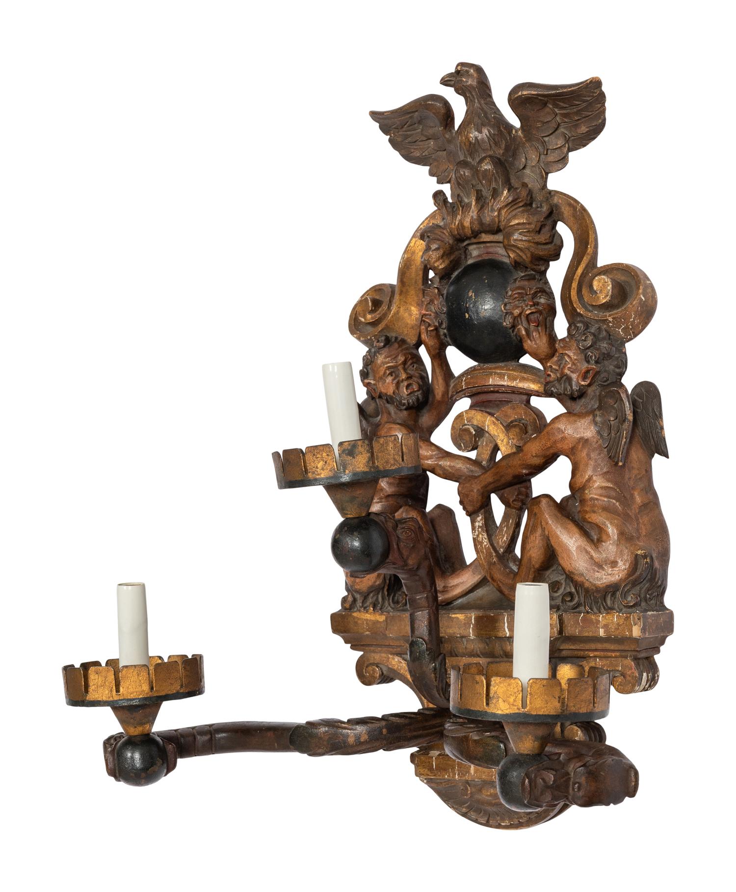 A Venetian Carved Walnut and Cast Iron Polychrome Decorated Three-Light Figural Sconce
