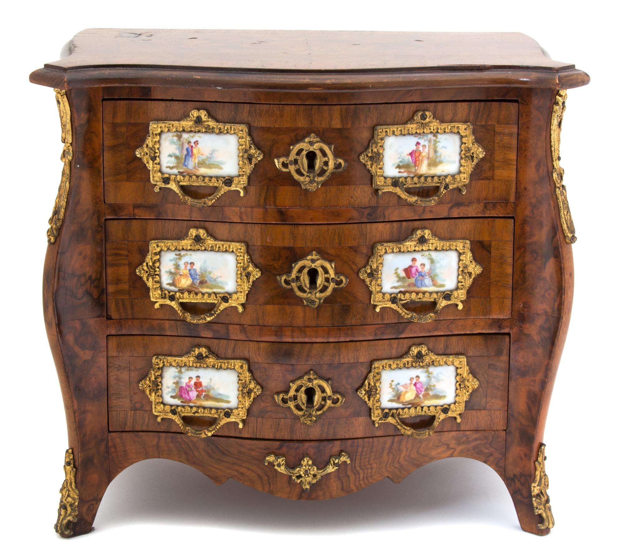 A Louis XV Style Porcelain and Gilt Metal Mounted Miniature Bombe Chest of Drawers — EARLY 20TH CENTURY