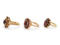 A Collection of Yellow Gold and Garnet Rings,