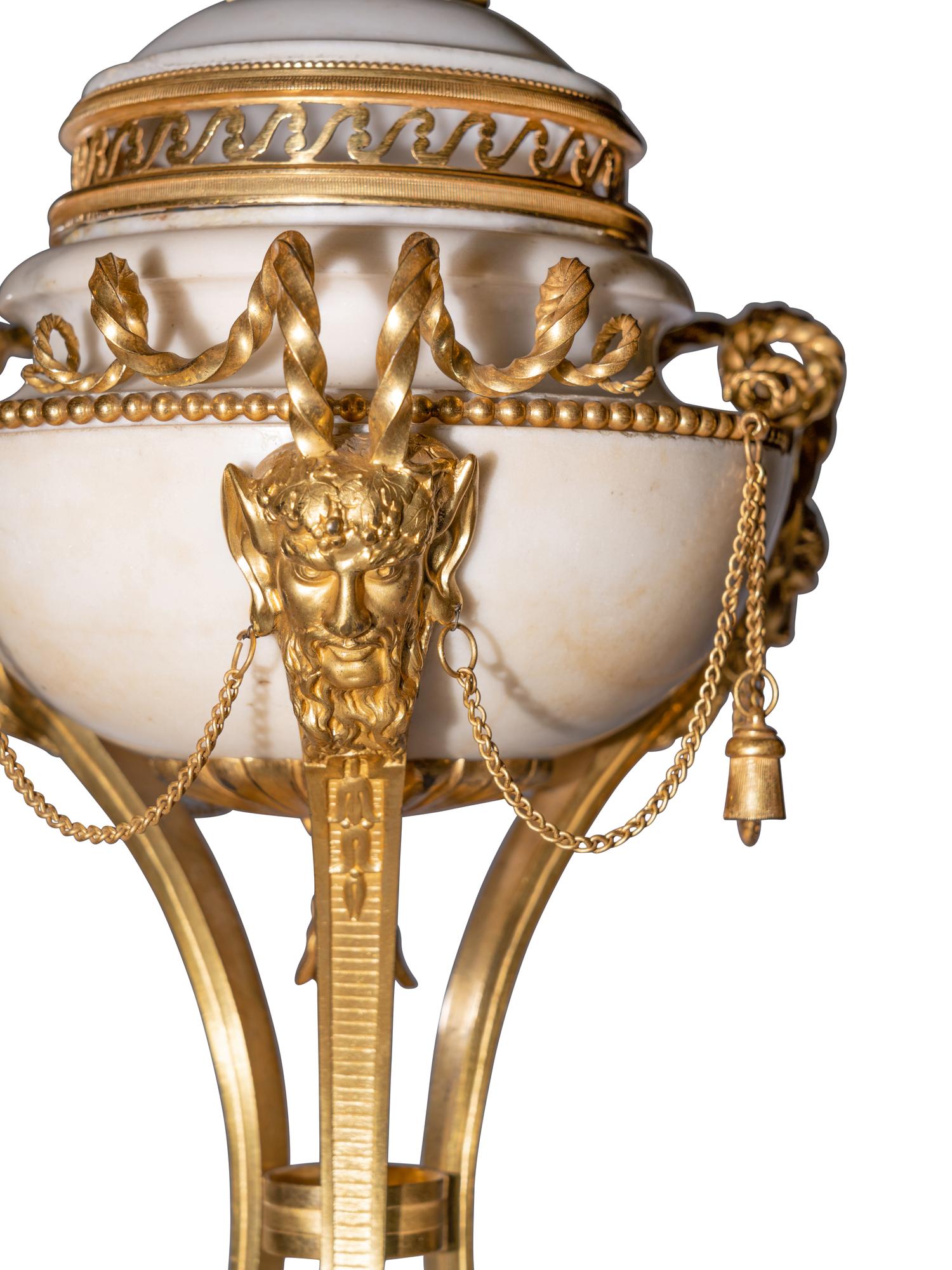 A Pair of Late Louis XVI Gilt Bronze Mounted White Marble Cassolettes