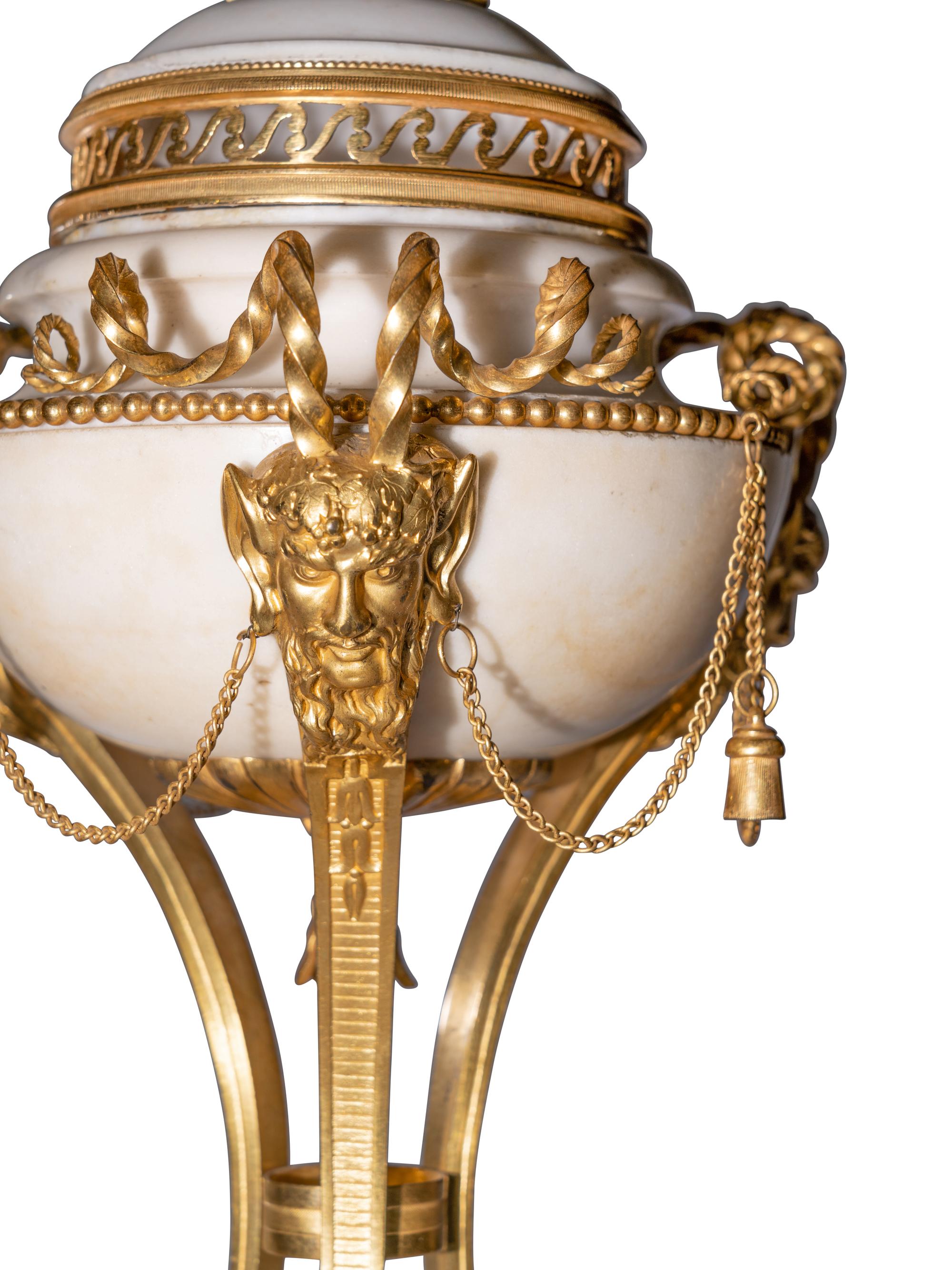 A Pair of Late Louis XVI Gilt Bronze Mounted White Marble Cassolettes