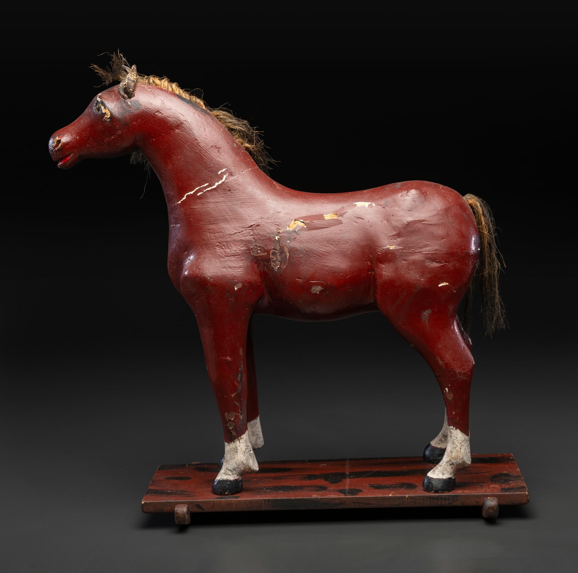 A Carved and Painted Wood Horse Pull Toy