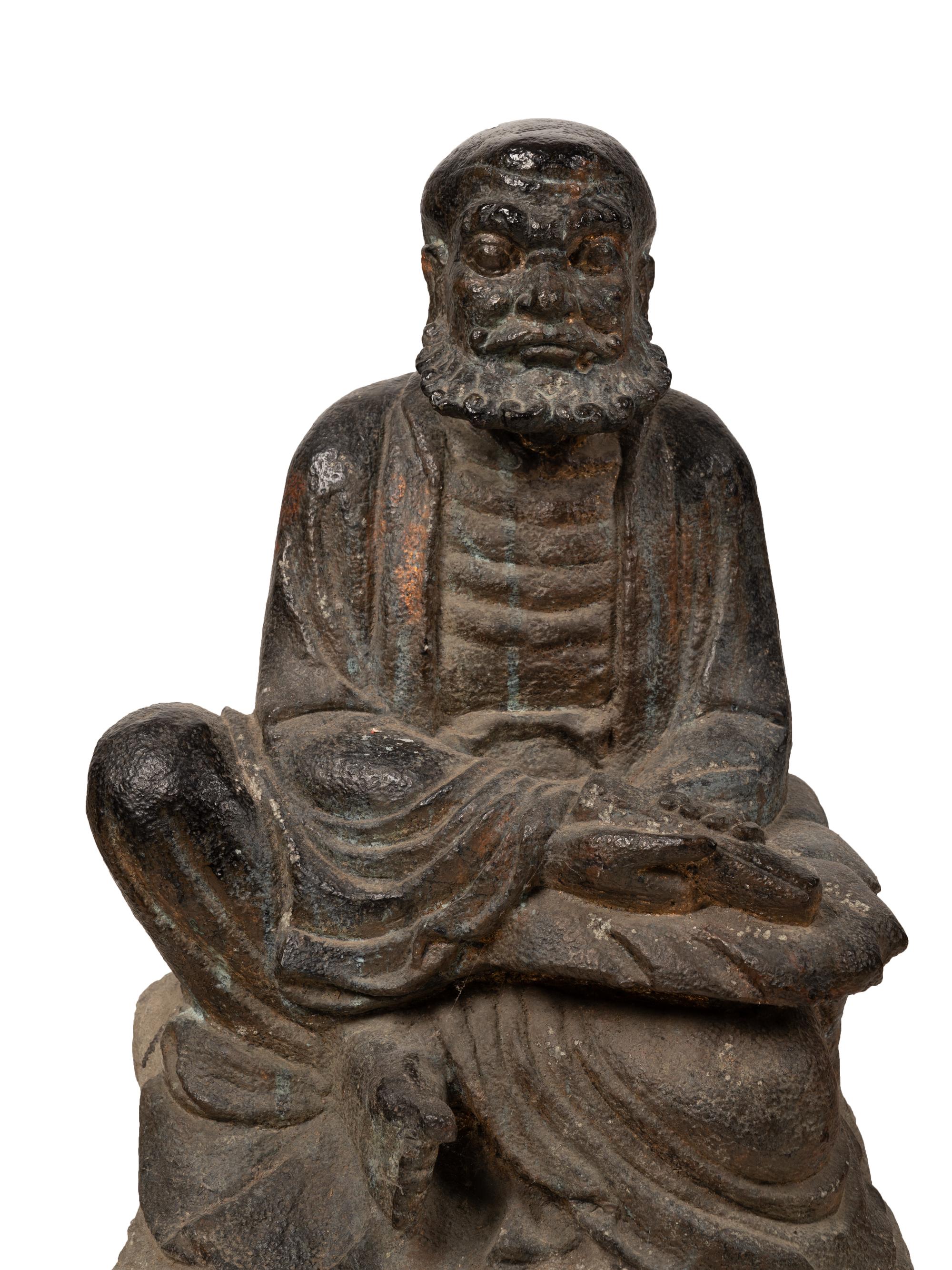 A Chinese Carved Stone Seated Figure