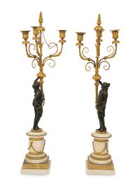 A Pair of French Patinated and Gilt Bronze Figural Three-Light Candelabra