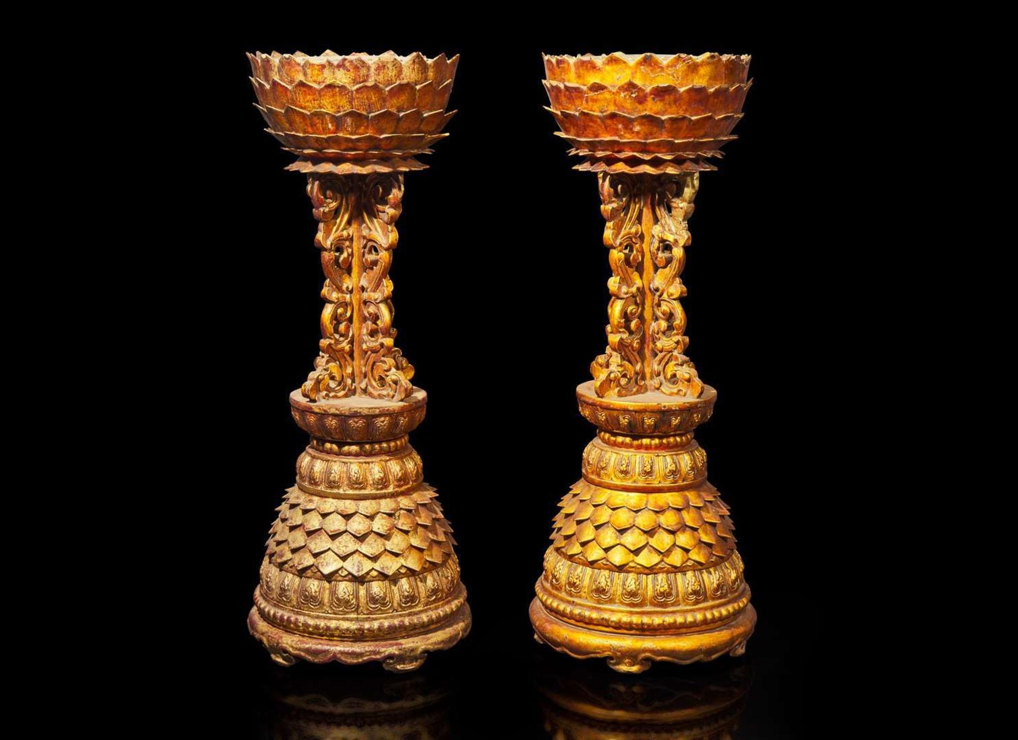 An associated pair of Chinese gilt-lacquered "Lotus" altar stands, Qing dynasty, 18th century or later 漆金蓮花燭臺或一對 清 十八世紀或更晚