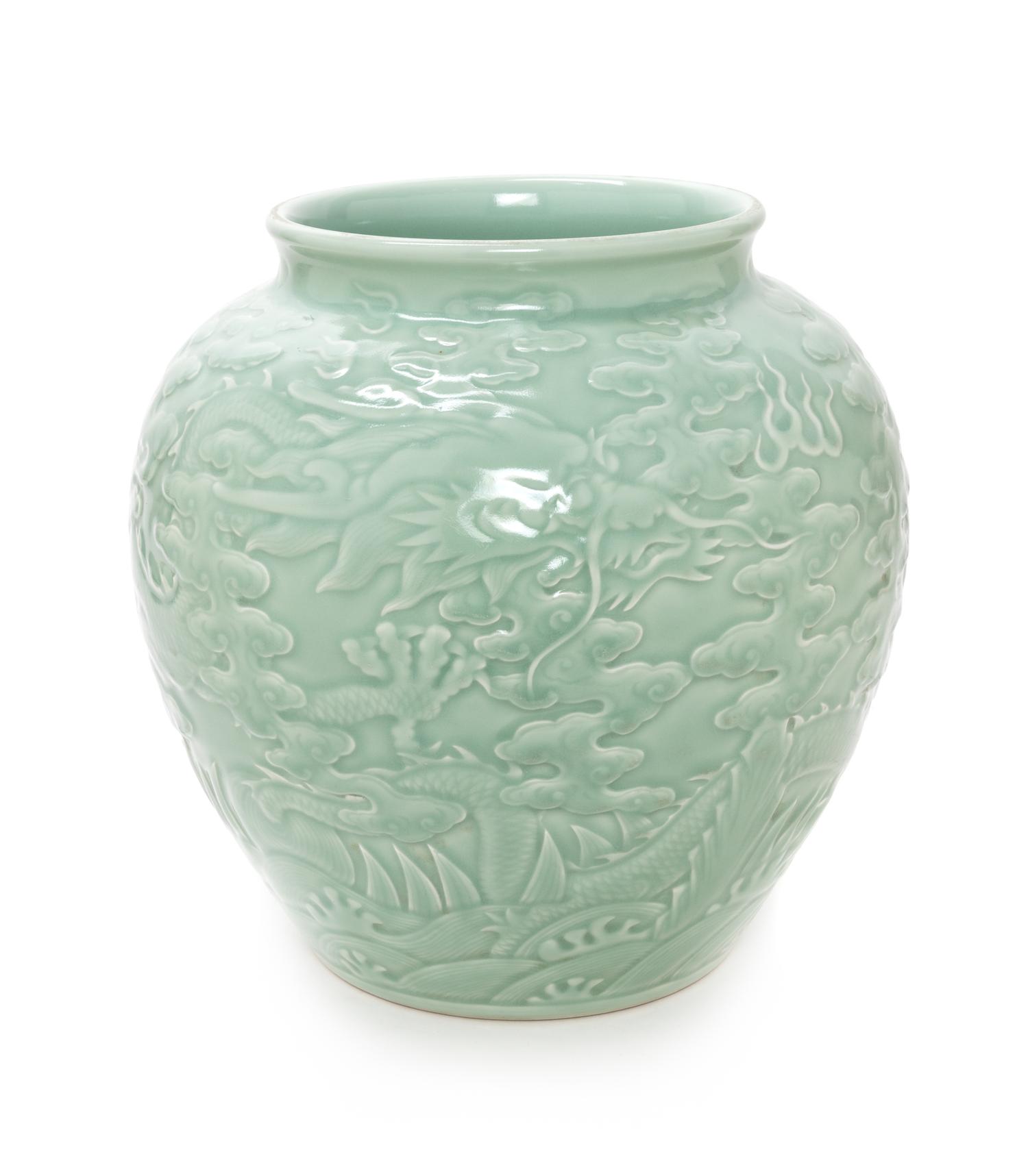 A Chinese Carved Celadon Glazed Porcelain Jar Height 12 1/2 inches. — 20TH CENTURY