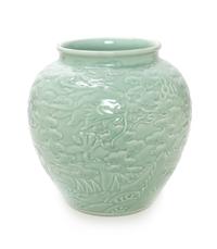 A Chinese Carved Celadon Glazed Porcelain Jar Height 12 1/2 inches. — 20TH CENTURY