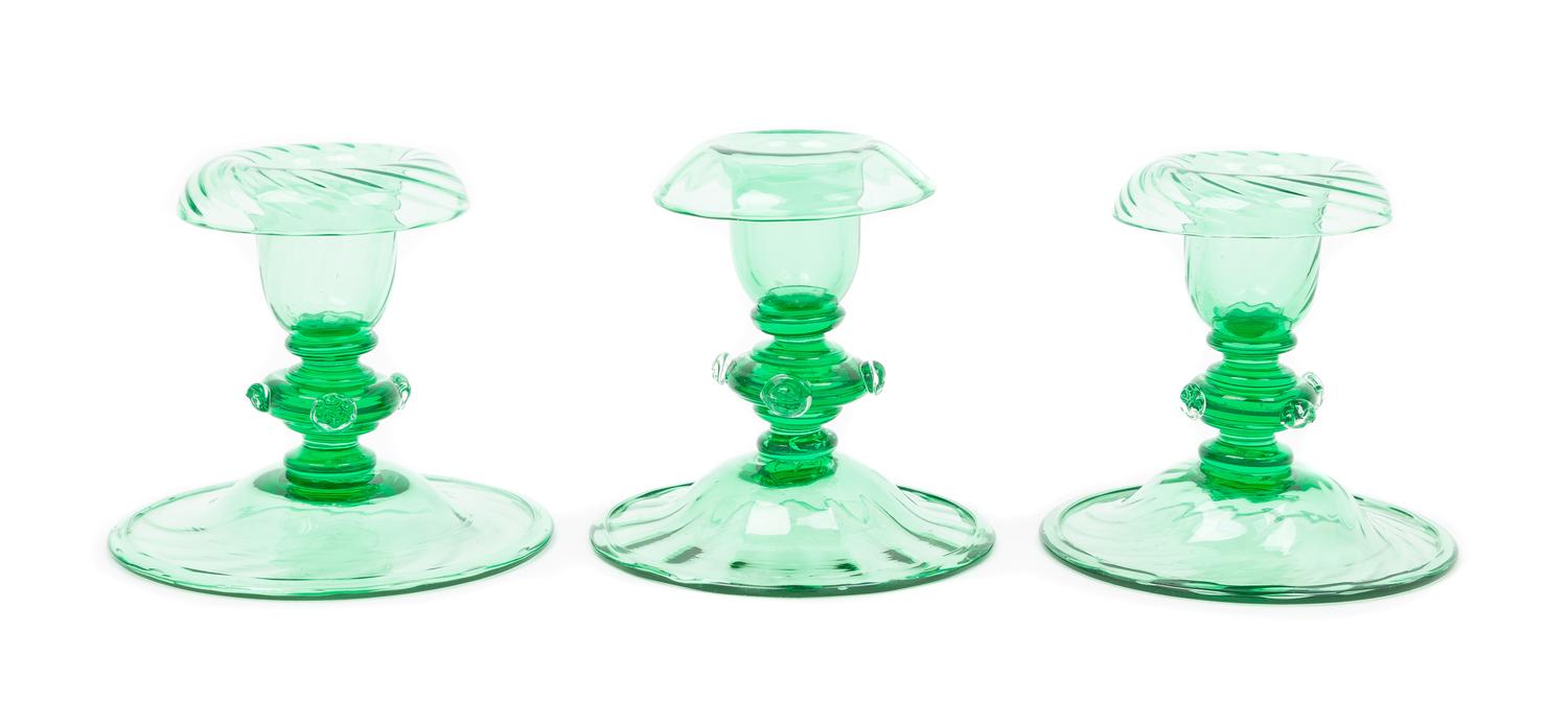 Steuben, 20TH CENTURY, three pomona green glass candlestick holders