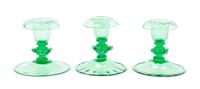 Steuben, 20TH CENTURY, three pomona green glass candlestick holders