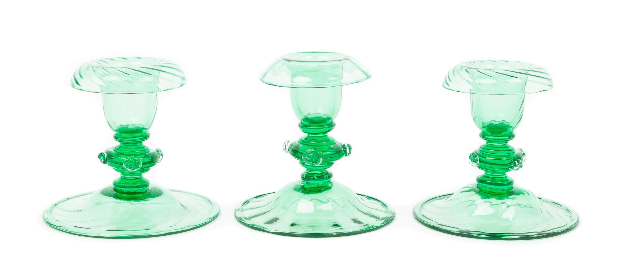 Steuben, 20TH CENTURY, three pomona green glass candlestick holders