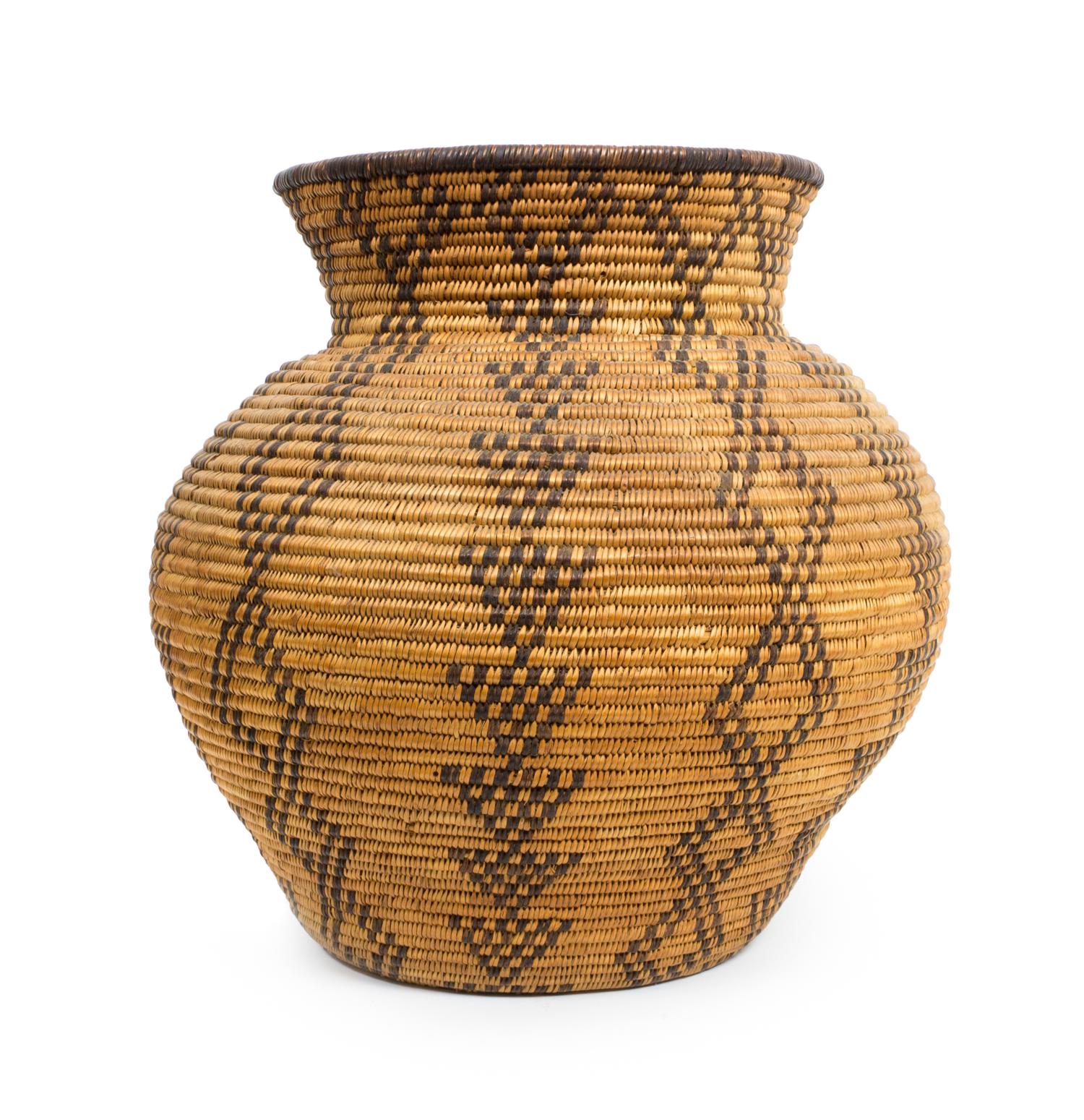 A Western Apache Storage Basket Height 9 1/2 x diameter 9 1/2 inches.