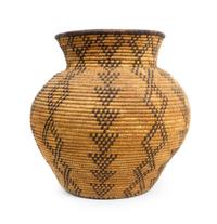 A Western Apache Storage Basket Height 9 1/2 x diameter 9 1/2 inches.