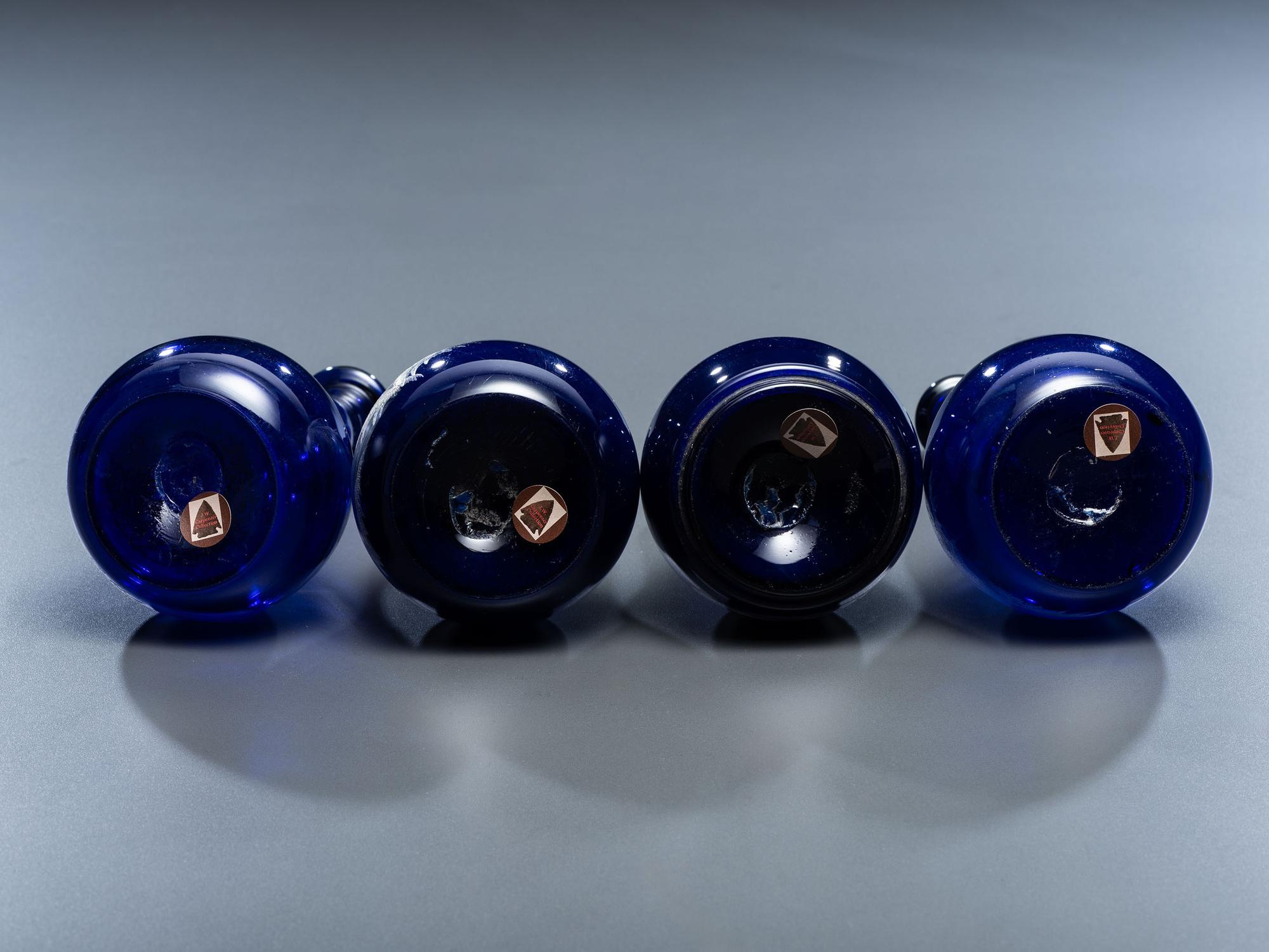 Four 'Mary Gregory' Cobalt Glass Barber Bottles