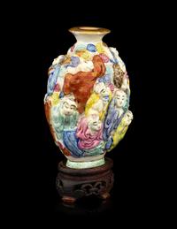 A Chinese Molded Famille Rose Porcelain Snuff Bottle