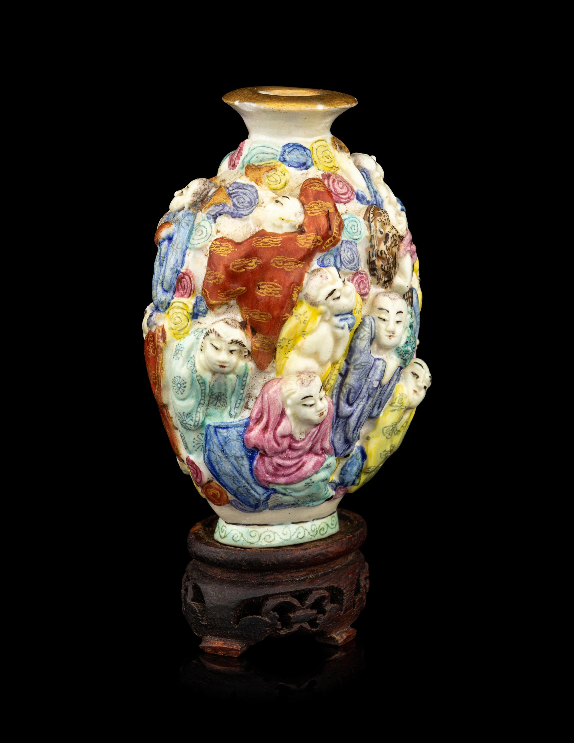 A Chinese Molded Famille Rose Porcelain Snuff Bottle