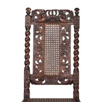 A William and Mary Crown-and-Flower Carved Oak and Cane Upholstered Side Chair