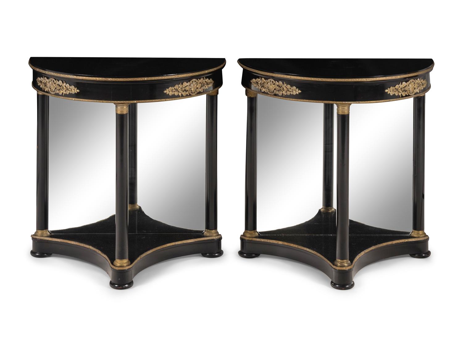 A Pair of Empire Style Gilt Bronze Mounted and Black Lacquered Demi Lune Console Tables