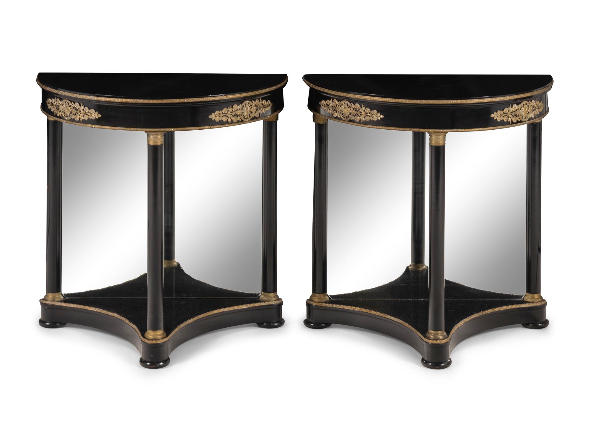 A Pair of Empire Style Gilt Bronze Mounted and Black Lacquered Demi Lune Console Tables