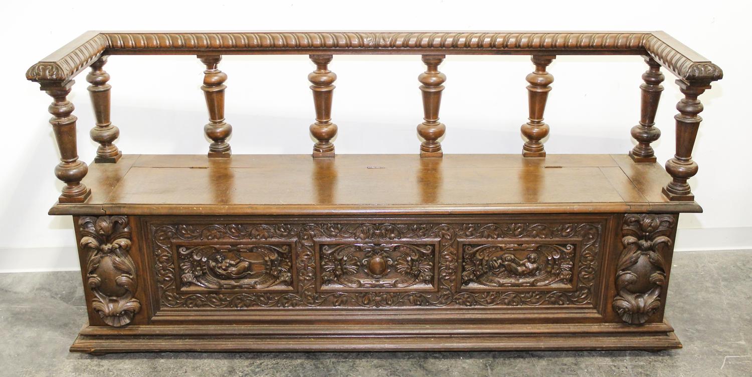 A Continental Carved Walnut Hall Bench. Width 74 inches.
