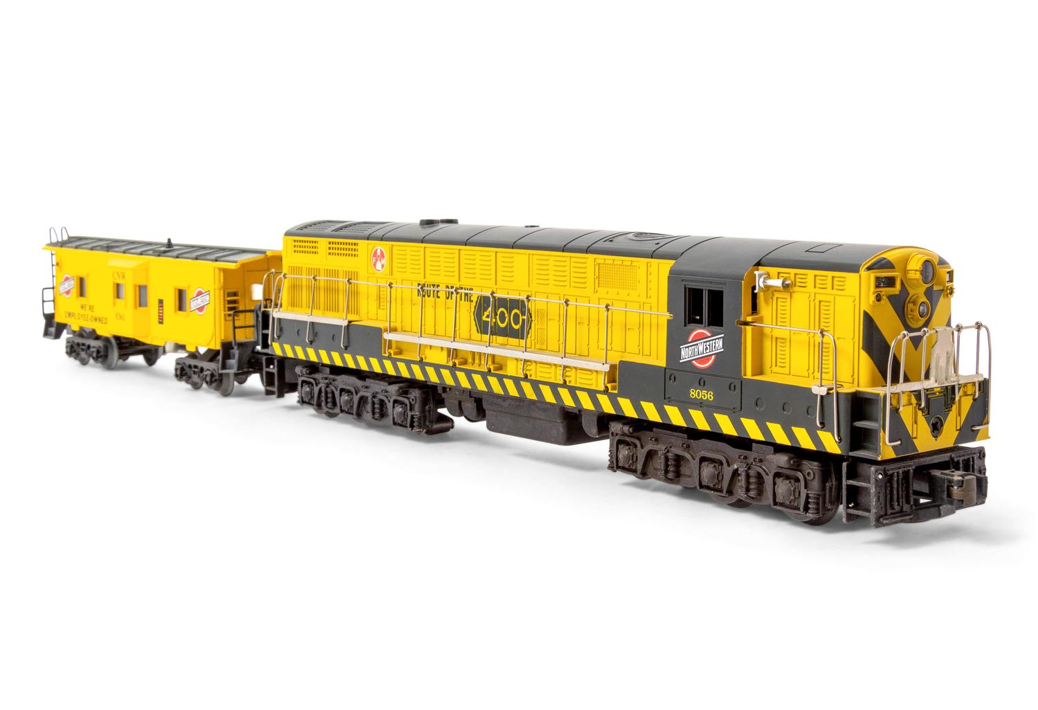 A Lionel Polychrome O-Gauge Chicago Northwestern System Diesel Locomotive and Caboose