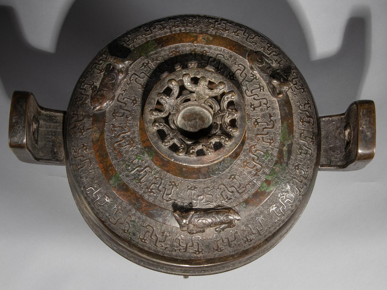 A Rare Archaistic Bronze Ritual Tripod Vessel and Cover, Ding