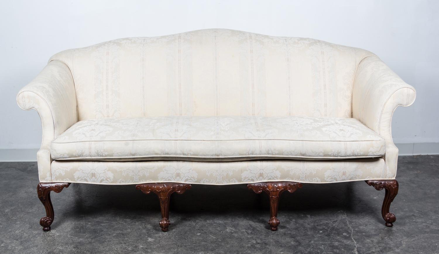 A Georgian Style Mahogany Camelback Sofa Height 39 x width 75 x depth 29 inches. — 20TH CENTURY
