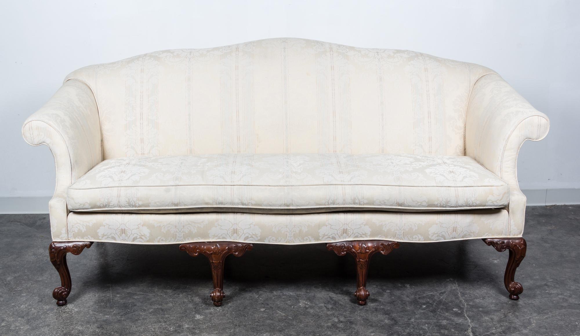 A Georgian Style Mahogany Camelback Sofa Height 39 x width 75 x depth 29 inches. — 20TH CENTURY