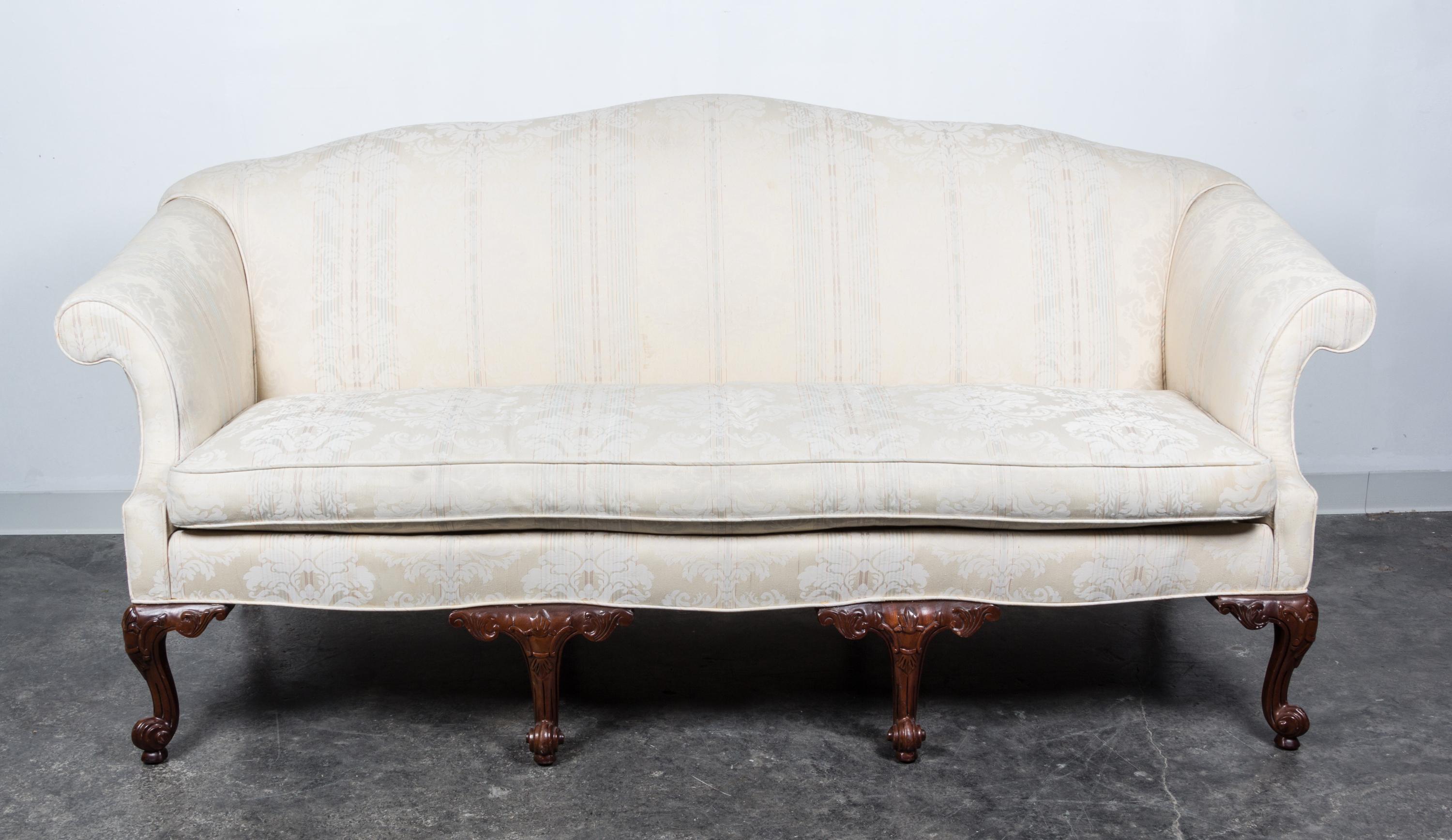A Georgian Style Mahogany Camelback Sofa Height 39 x width 75 x depth 29 inches. — 20TH CENTURY