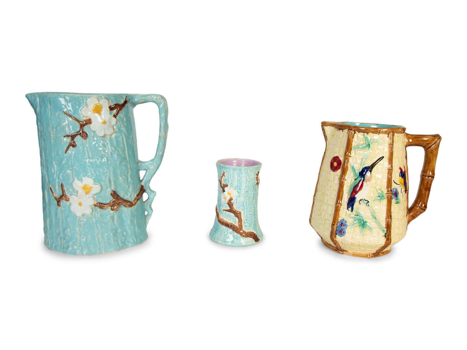 A Holdcroft English Majolica Turquoise Dogwood Pitcher and Cup and a Fielding Majolica Hummingbird Pitcher — 19th Century