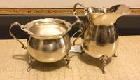 An American Silver Sugar and Creamer Set, Luraline, each having a scalloped rim.