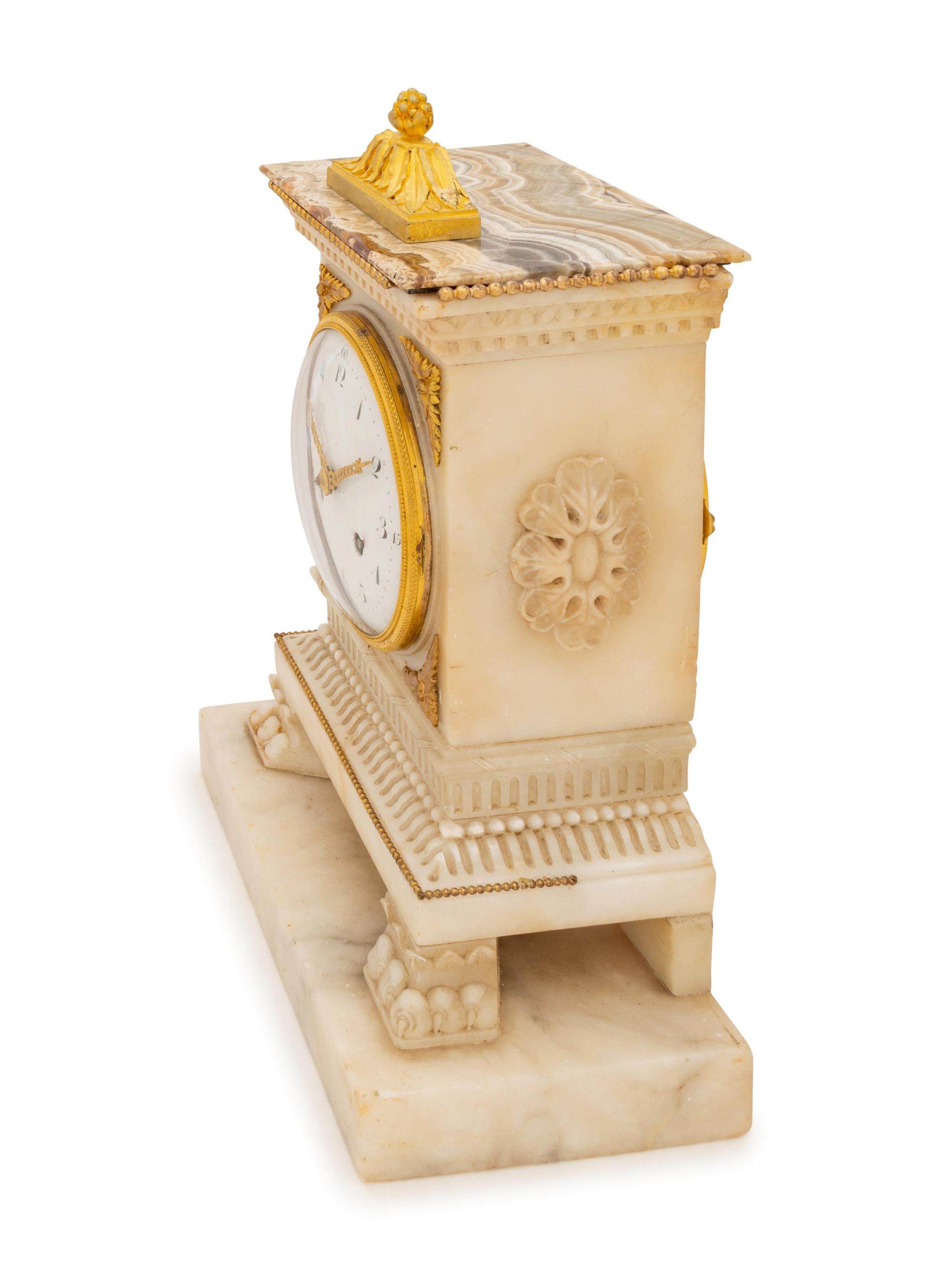A Continental Gilt Bronze Mounted Alabaster Mantel Clock
