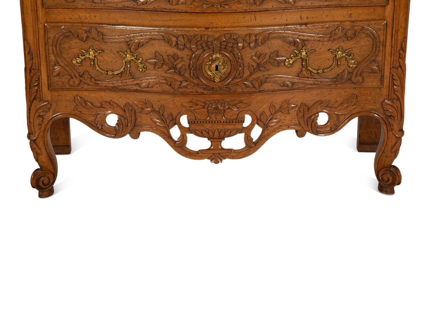 A French Provincial Carved Oak Commode